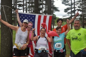 Runners in Front of Flag